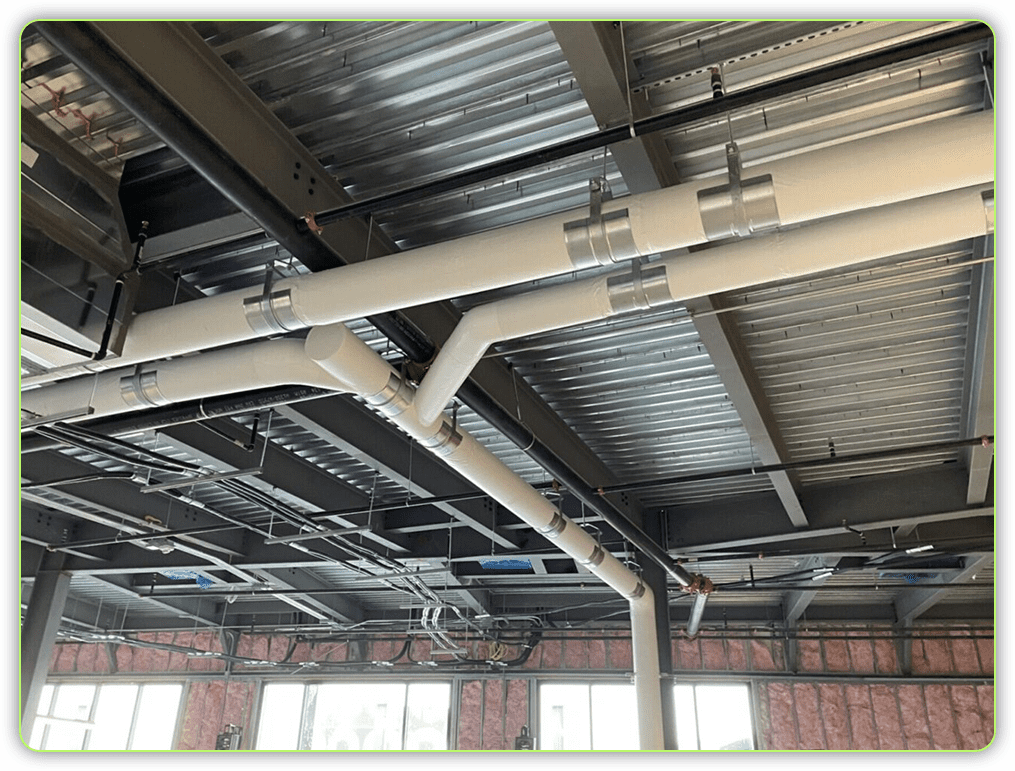 A view of the ceiling in an industrial building.