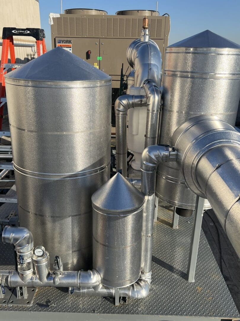 A close up of some pipes and tanks