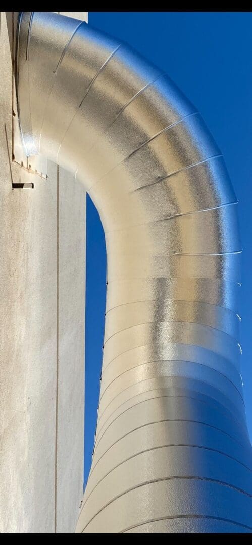 A close up of the side of a metal pipe